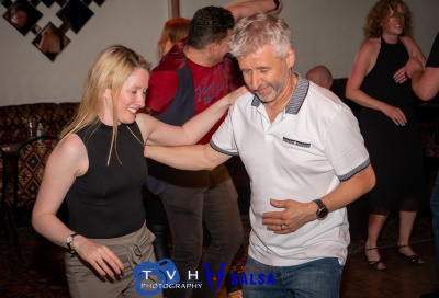 two people learning to dance salsa